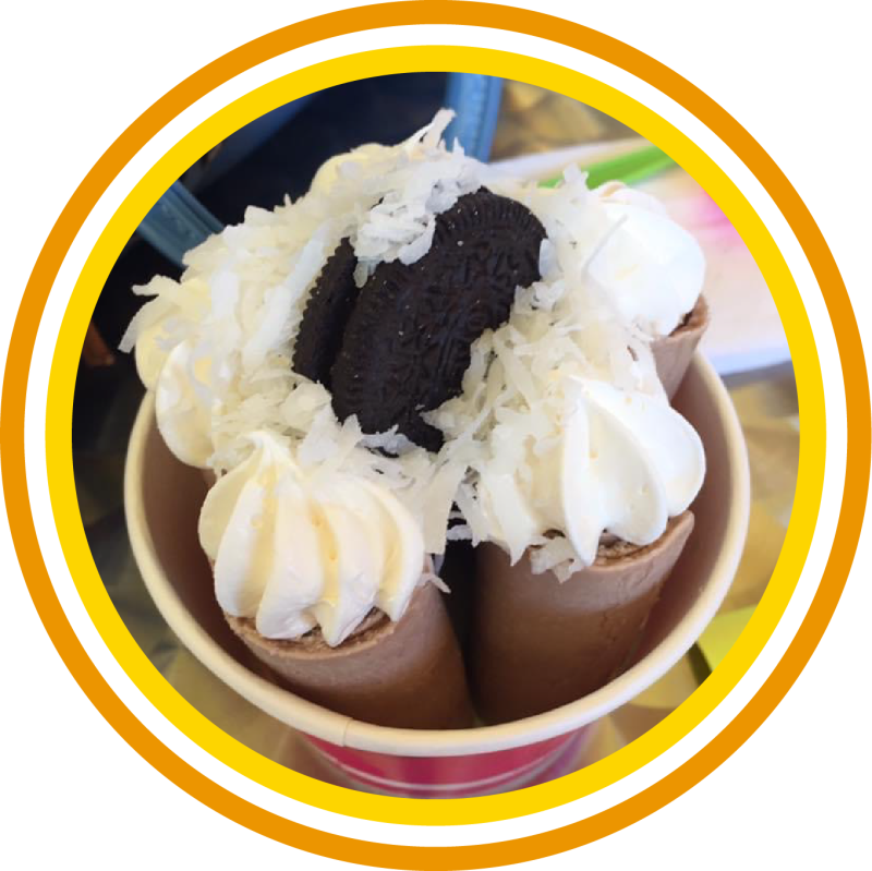 Cup of fresh hand-rolled ice cream with whipped cream